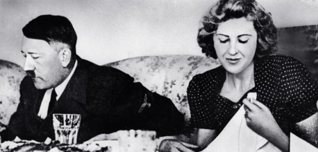 German dictator Adolf Hitler and his mistress Eva Braun dine in a still from a private home movie made by Braun s siste