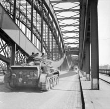 The British Army in North-west Europe 1944-45 Cromwell tanks of 7th Armoured Division pass over a bridge in Hamburg, 4 M