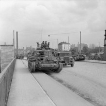The British Army in North-west Europe 1944-45 Cromwell tanks of 7th Armoured Division in Hamburg, 3 May 1945. Copyright: