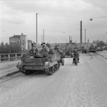 The British Army in North-west Europe 1944-45 Universal carriers of 7th Armoured Division in Hamburg, 3 May 1945. Copyri