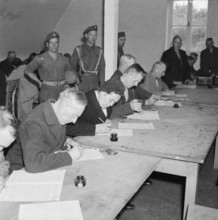 Germany Under Allied Occupation 1945 Suspected Nazis fill in a questionnaire about their political activities in a deten