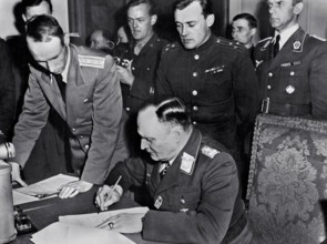 On May 7, 1945 the German General Alfred Jodl unconditionally surrendered all German forces to the Allies at Reims, in
