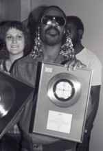 Stevie Wonder London, UK. LIBRARY. Stevie Wonder is presented a silver disc to celebrate sales of 250,000 in the UK for