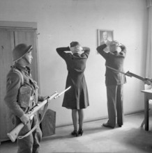 Germany Under Allied Occupation Prisoners under guard during the operation to arrest members of the German Government ca