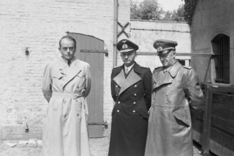 Nazi Personalities Albert Speer 1905 - 1984): Speer with Doenitz and Jodl after his arrest by the British Army. - Seems