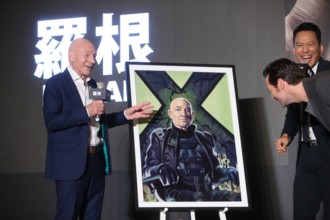 TAIPEI CHINA FEBRUARY 28 English actor Patrick Stewart L Australian actor and singer Hugh Jac
