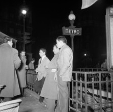 Poll photo collection. Nightlife in Paris. North African men are at a metro entrance. undated. France Paris Copyright: x