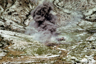 RECORD DATE NOT STATED Smoke and dust rise into the air as several bombs dropped by a Navy aircraft explode in the impac