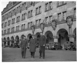 RECORD DATE NOT STATED  Original Caption: Shown leaving the Palace of Justice at Nurenburg, are left to right: Col. Char