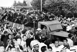 China / USSR: Chinese residents of the city of Harbin welcome Soviet liberators from Japanese occupation, August 1945 Ch