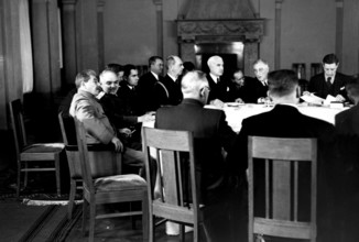 WW2: Conference in session; Stalin listening to Maisky on the left, on the right is President F D Roosevelt, Hopkins an