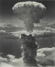 Atomic bomb over Nagasaki, Japan Nagasaki, Japan under atomic bomb attack August 9, 1945. Atomic bomb mushroom cloud ov