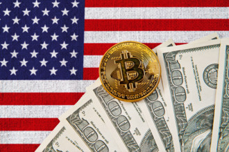 Germany - November 6, 2024: Bitcoin coin and US dollar bills in front of the American flag. Symbolic image for the role