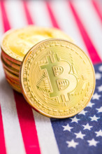 Bitcoin gold coin. Cryptocurrency on american flag Bitcoin gold coin. Cryptocurrency on the american flag Copyright: xZo