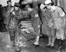 Japan: Post World War II, uniformed Japanese bow to their American conquerors. On 6 August and 9 August, 1945, the USA d