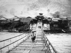 RECORD DATE NOT STATED China: Muleteers crossing the Luding Bridge over the Dadu River in Luding County, Garze Tibetan A
