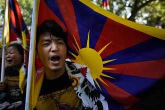 NEW DELHI INDIA MARCH 10 Exiled Tibetans shout slogans as they participate in a protest to mark