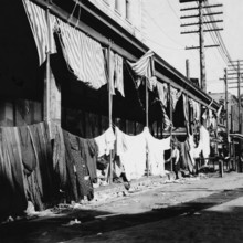 USA: The 1900 Galveston Hurricane. Galveston disaster, merchants drying goods after flood , 1900 The Hurricane of 1900 m