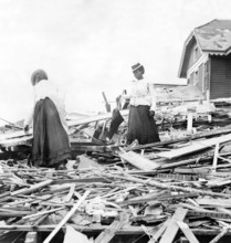 USA: The 1900 Galveston Hurricane. Two women trying to find where their home stood , 1900 The Hurricane of 1900 made lan