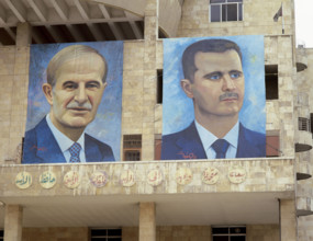 Presidents of Syria. Left: Hafez al-Asad (1930-2000), right: Basahr al-Assad (1965). Large portraits, Damascus, Syria. P