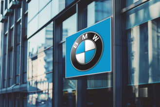 Illuminated banner with bmw car manufacturer s logo on a glass office building. Illuminated banner with bmw car manufact