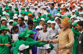 NEW DELHI, INDIA - AUGUST 15: Prime Minister Narendra Modi (C) interacts with school children after delivering his Inde