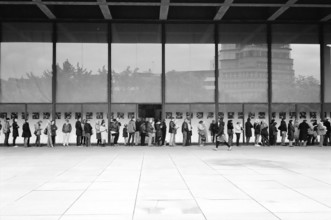 People Waiting in Line at Neue Nationalgalerie Lines of visitors wrap around the architecturally interesting Neue Nation