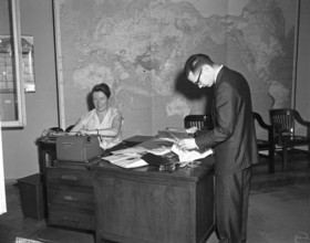 Trip to Europe: Arrival in Vienna, Austria 10:50AM; White House Army Signal Agency (WHASA) staff in Vienna. An unidentif