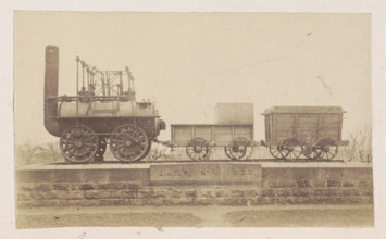 RECORD DATE NOT STATED  Locomotive with trailers on a pedestal, anonymous, 1878 - 1890 photograph On a brick base is a s