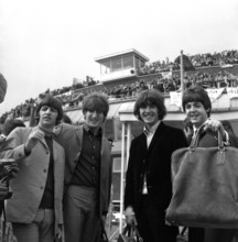 The Beatles leaving London airport for a nationwide tour of the USA More than 500 screaming fans w