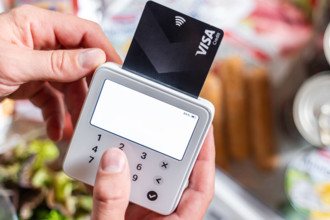 Bavaria, Germany - August 27, 2025: A customer pays for groceries in a supermarket with a credit card. Symbolic photo fo