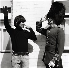 George Harrison and  Victor Spinetti (1965)