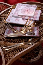 Dinner from the Deep North: gilded place settings with Russian pattern napkins layed on snowshoes