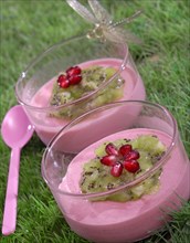 Meal in pink and green theme: strawberry mousses and kiwi compote