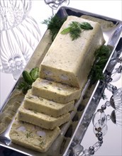 Christmas dinner with strass: terrine with cream of fennel and scampis
