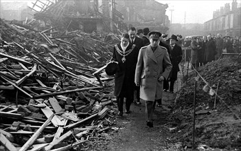 King George VI visits Birmingham to survey the bomb damage after a bombing raid in world War
