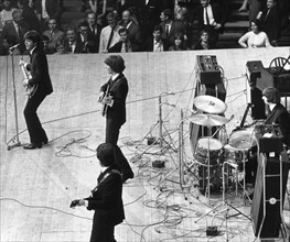The Beatles on stage at the Palais des Sport in Paris.
June 1964.