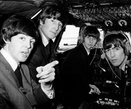 Beatles pop band in the cockpit of an aircraft on the way to the Northern Premiere of a 'Hard day's