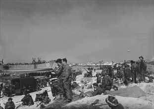 British and Allied troops on the beaches of Normandy France after the D-Day landings. WW2 1944