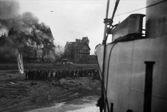 British troops under fire on Juno beach at  Normandy shortly after the D-Day landings. 
Soon after