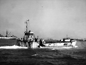 Landing craft loaded with troops head towards the Normandy beaches during D Day invasion.  WW2