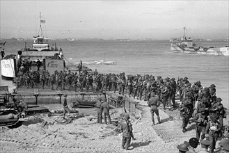 British re enforcement land on Gold beach for the big push into the Normandy town of Caen. June
