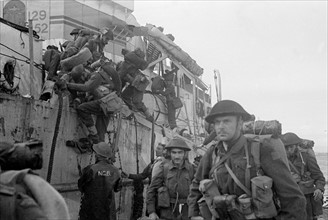 British re enforcement land on Gold beach for the big push into the Normandy town of Caen. June