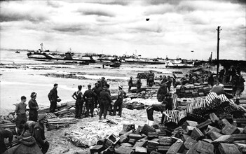 Invasion of Normandy  1944
British and Commonwealth troops stand amongst the ammunition boxes and