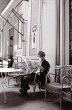 Street Cafe Newspaper Reader