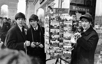 Paul MCCartney (left), George Harrison and John Lennon on the Champs Elysees before Ringo arrived