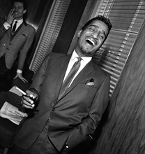 Sammy Davis Jnr at a press reception in Soho cinema showing slips of his new film Robin and his