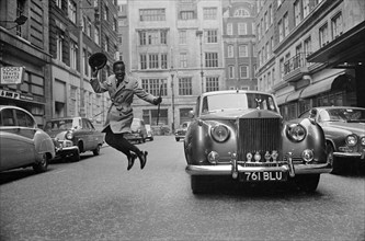 Sammy Davis Jnr. in London with his new Rolls Royce.
31st March 1963.
1963-746-RollA