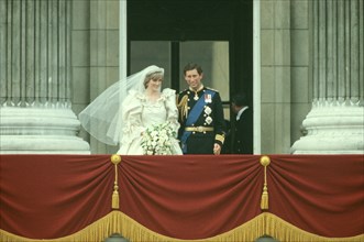 Prince Charles and Princess Diana get married.