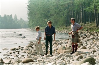 Prince Charles with sons Prince William and Prince Harry. Pictured on the banks of the River Dee at